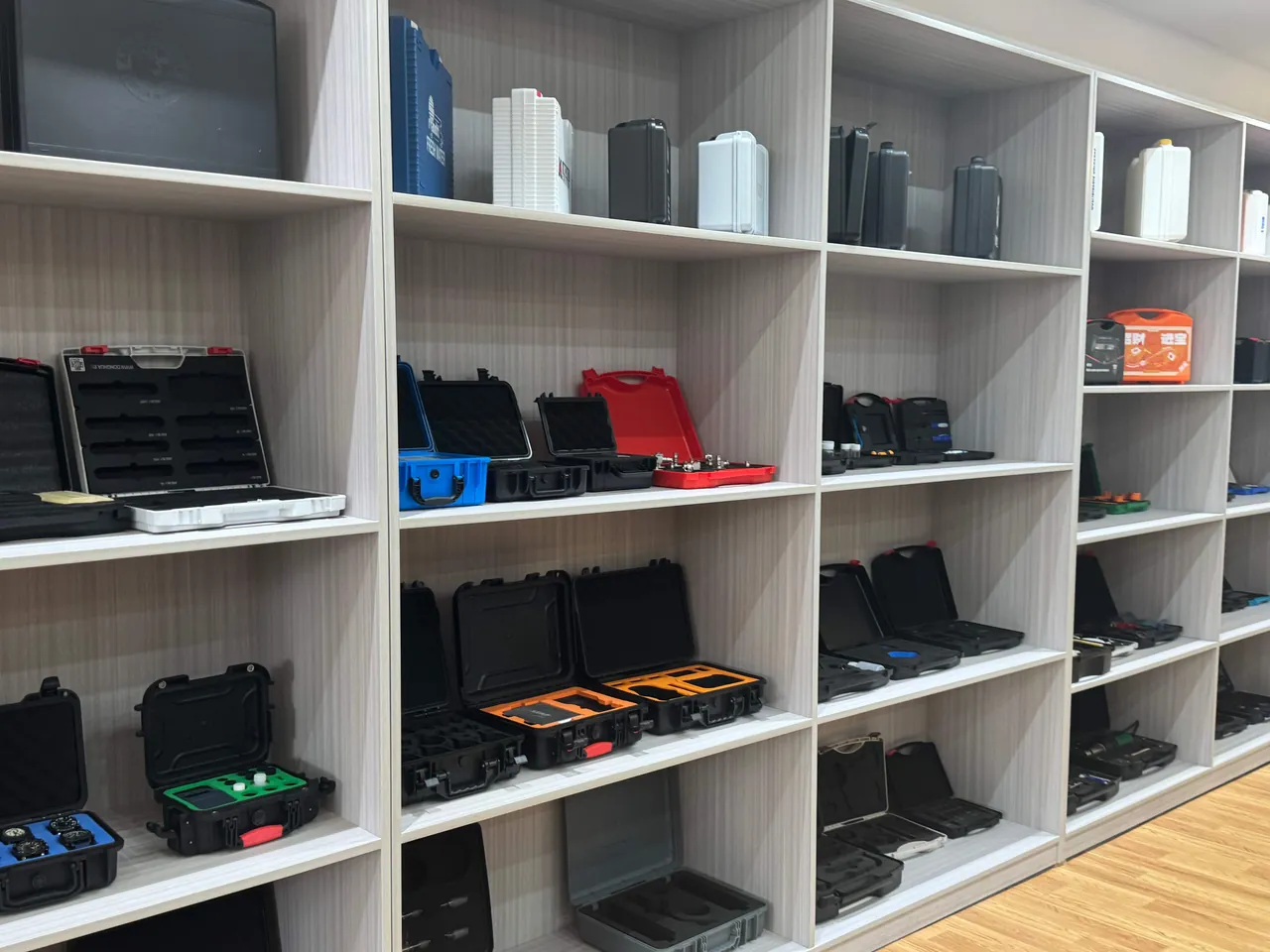 Printed-part cases after vibration and drop verification awaiting appearance and dimensional re-inspection on a test bench