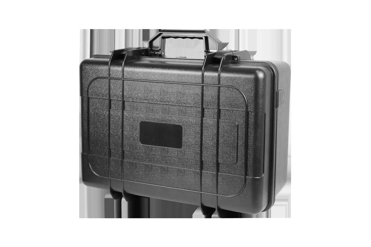 Three-quarter view of the black case, both latches and the top handle in frame, front label recess visible
