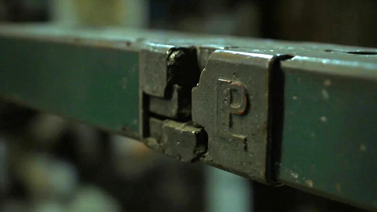 Close-up of a deformed latch keeper