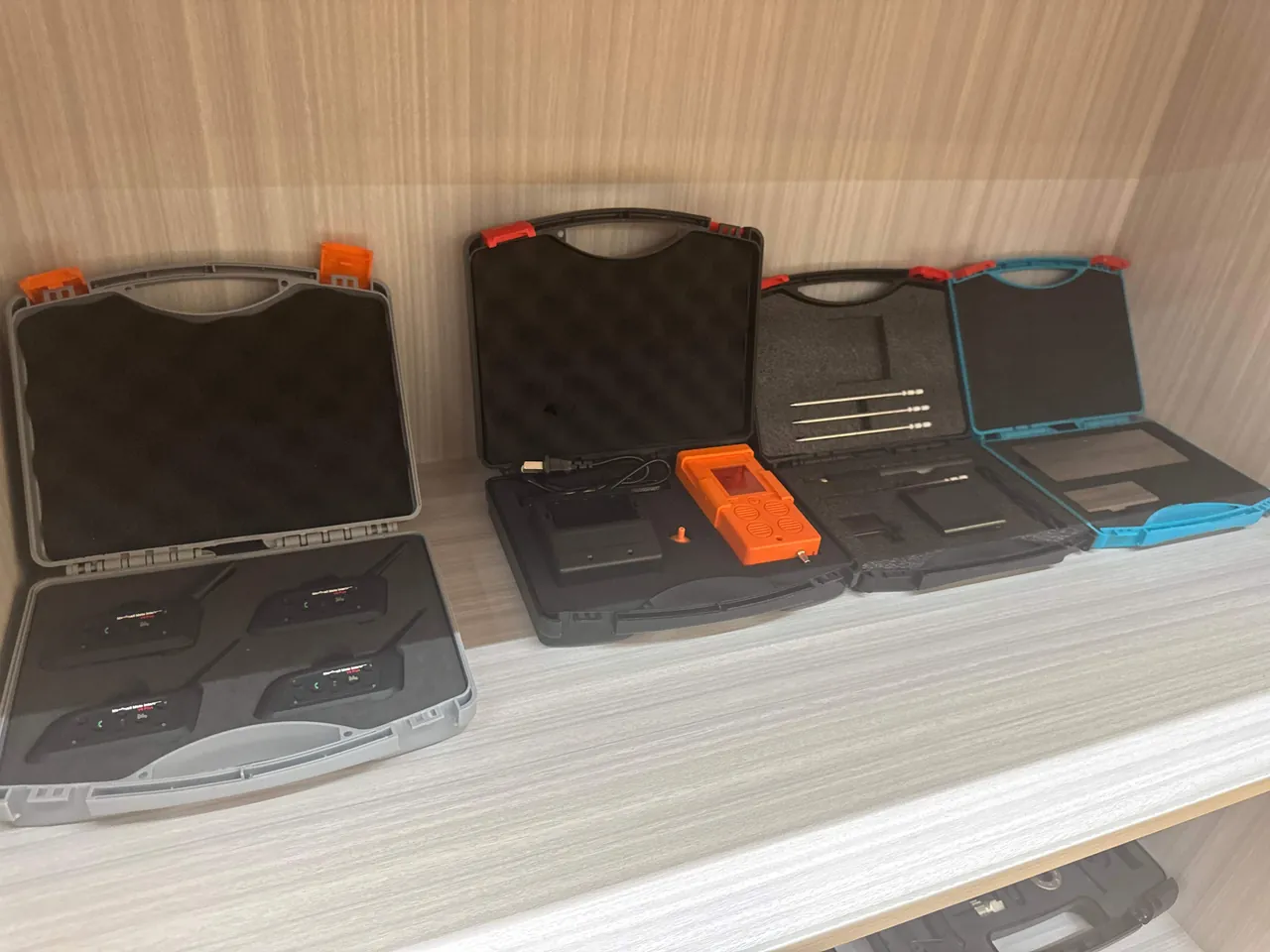 ATM cassette transport cases stacked by slot on the rack of a cash loading vehicle