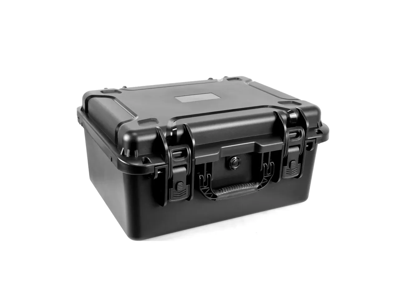 Black case closed at an angle, two draw latches with metal pins on the front, folding handle in the middle, blank rectangular label area on the lid