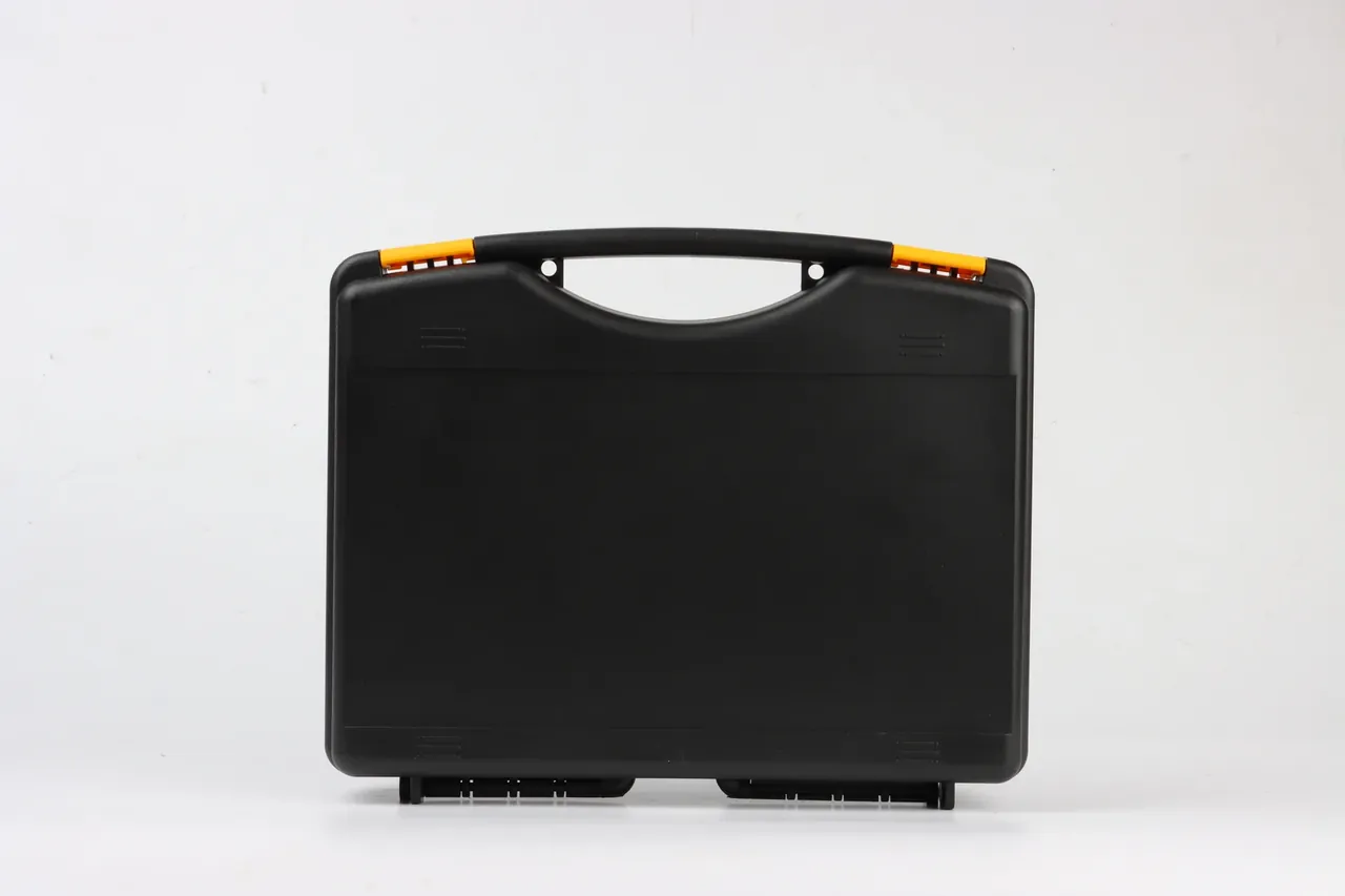 Case Internal Divider: one matte black moulded case facing forward on white, lid closed, handle raised, an orange latch clip at each end