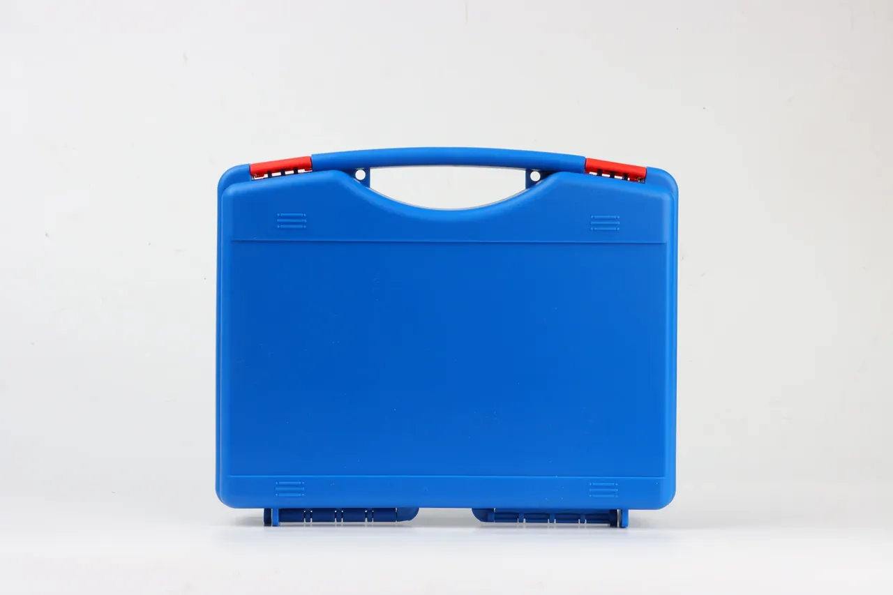 Case Internal Divider: one cobalt blue moulded case front on against white, lid shut, handle raised, red latch clips engaged, twin feet and ribs