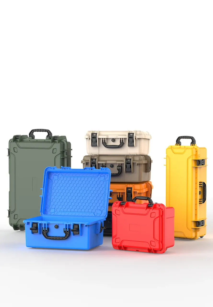Packing Cases in colour sets, olive and yellow tall cases standing, a blue case open with egg-crate foam, a red case closed
