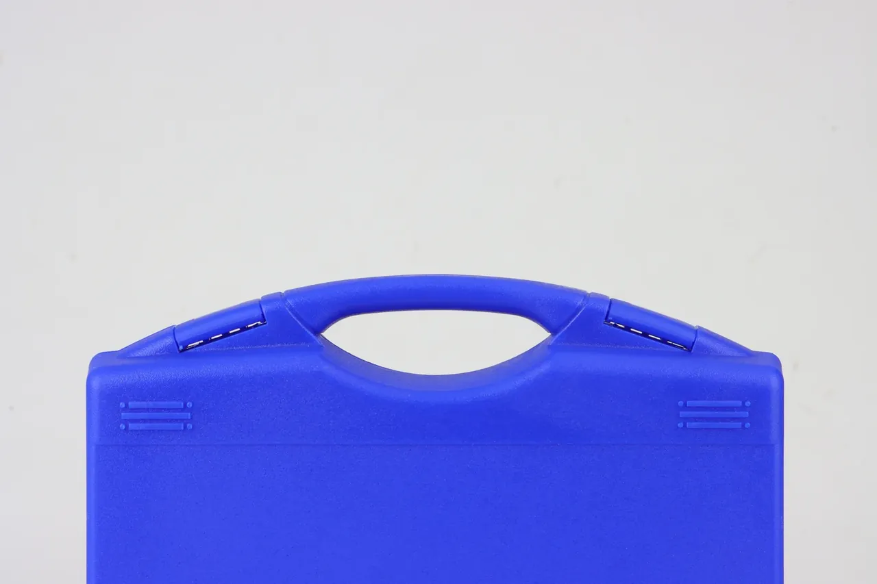 Case Showroom: handle end of the bright blue case, arched folding handle between two hinge barrels with pins showing, paired ribs on the shoulder
