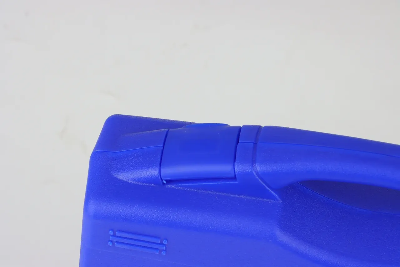 Case Showroom: hinge barrel across the lid seam at a blue corner, pin at the barrel end, diagonal seam, rectangular ribs below