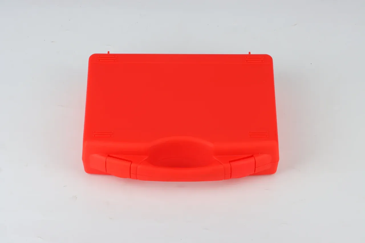 Case Showroom: a red case lying face up, the handle along the bottom edge, a hinge block at each end, short ribs at four corners