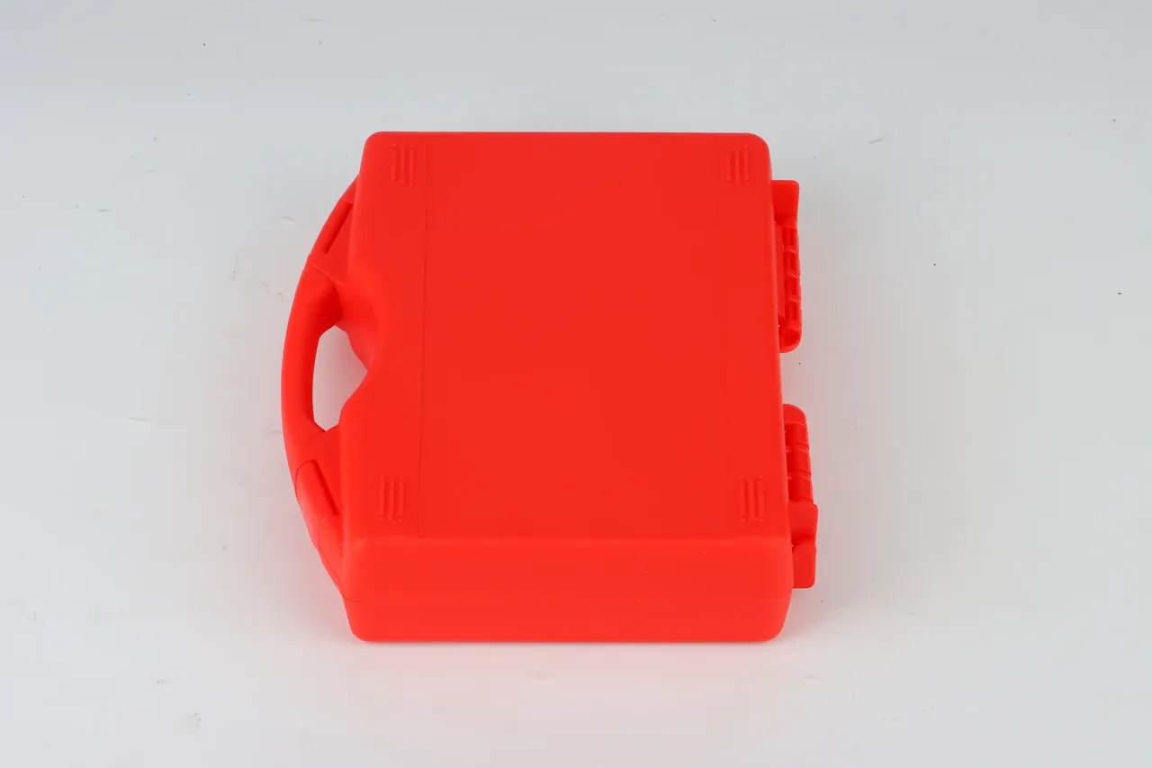 Case Showroom: the red case seen from above, handle on the left, two latch seats bulging from the right edge, two ribs at each corner