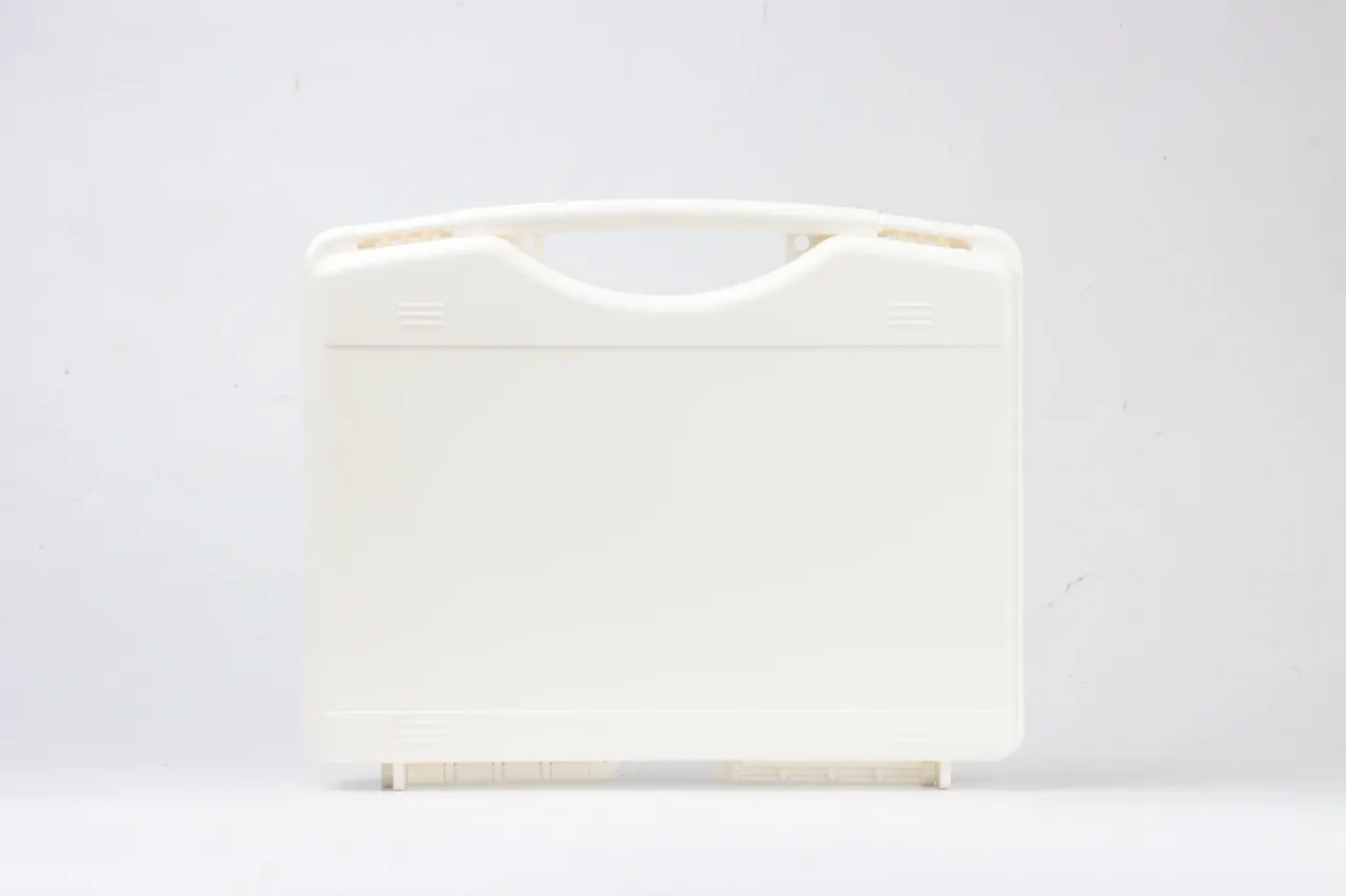 Warranty Terms part check on a cream case, lid shut, folding handle in a top notch, ribs either side, two feet below