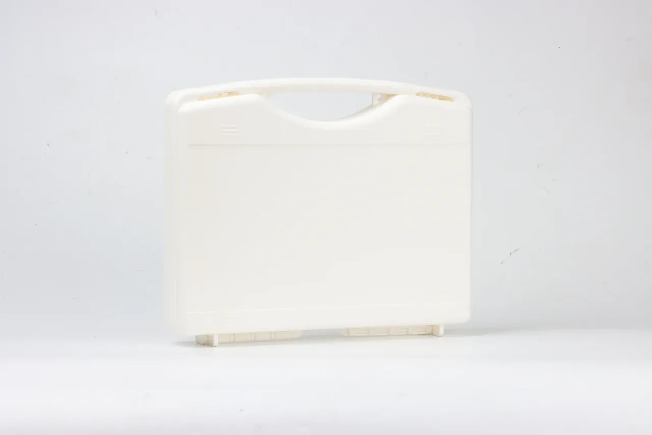 Warranty Terms dispute photo of a cream case close up, lid shut, folding handle over a notch, ribs both sides, feet below