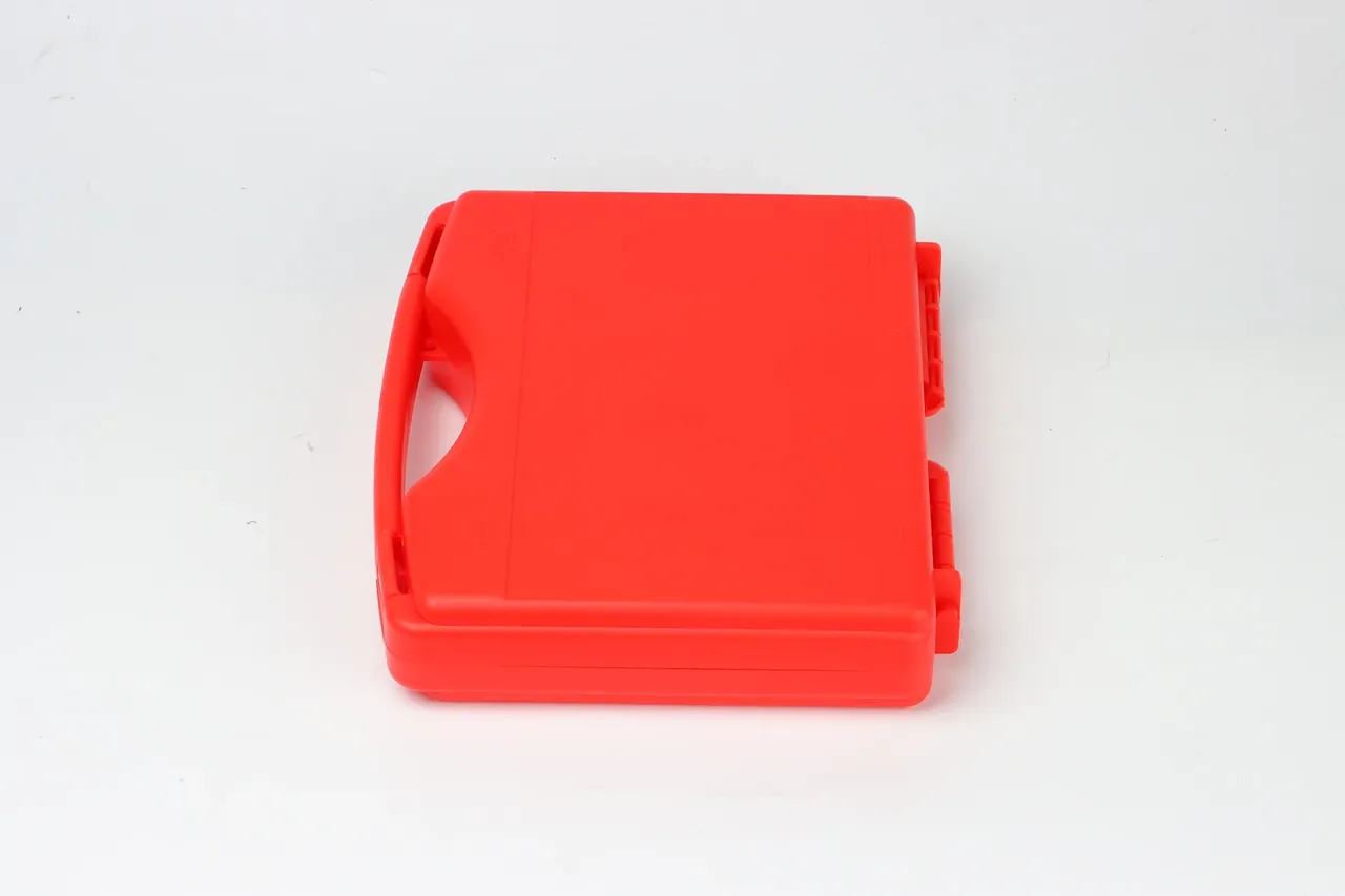 Case weight and freight: vermilion case on its side, handle left, two hinge barrels offset half a pitch, plain lid, crisp parting line