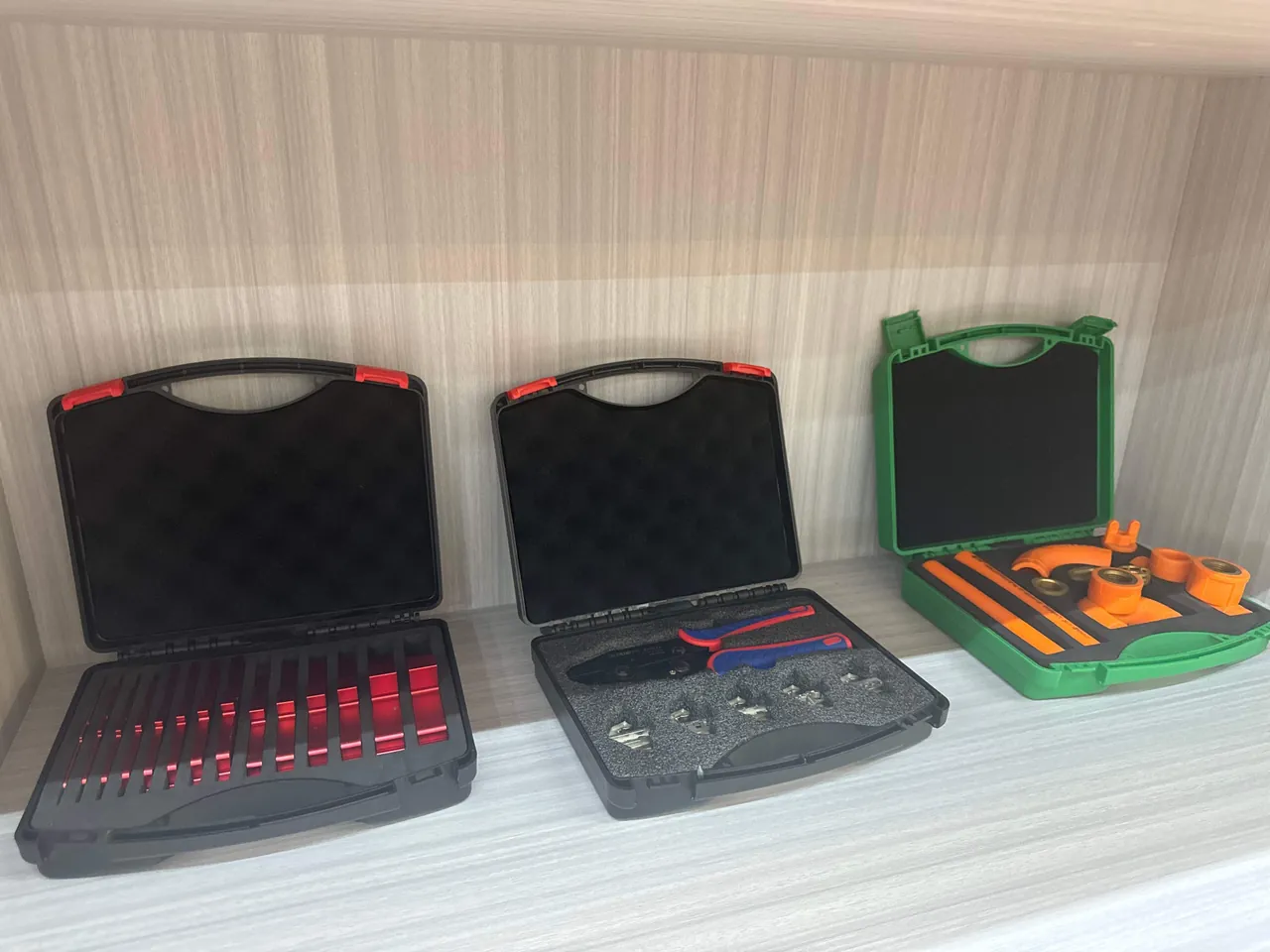 Stacked cash-in-transit cases on vault shelving with serial plates and tracking labels