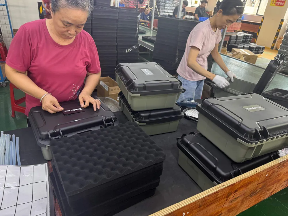 Worker assembling a protective case on the line