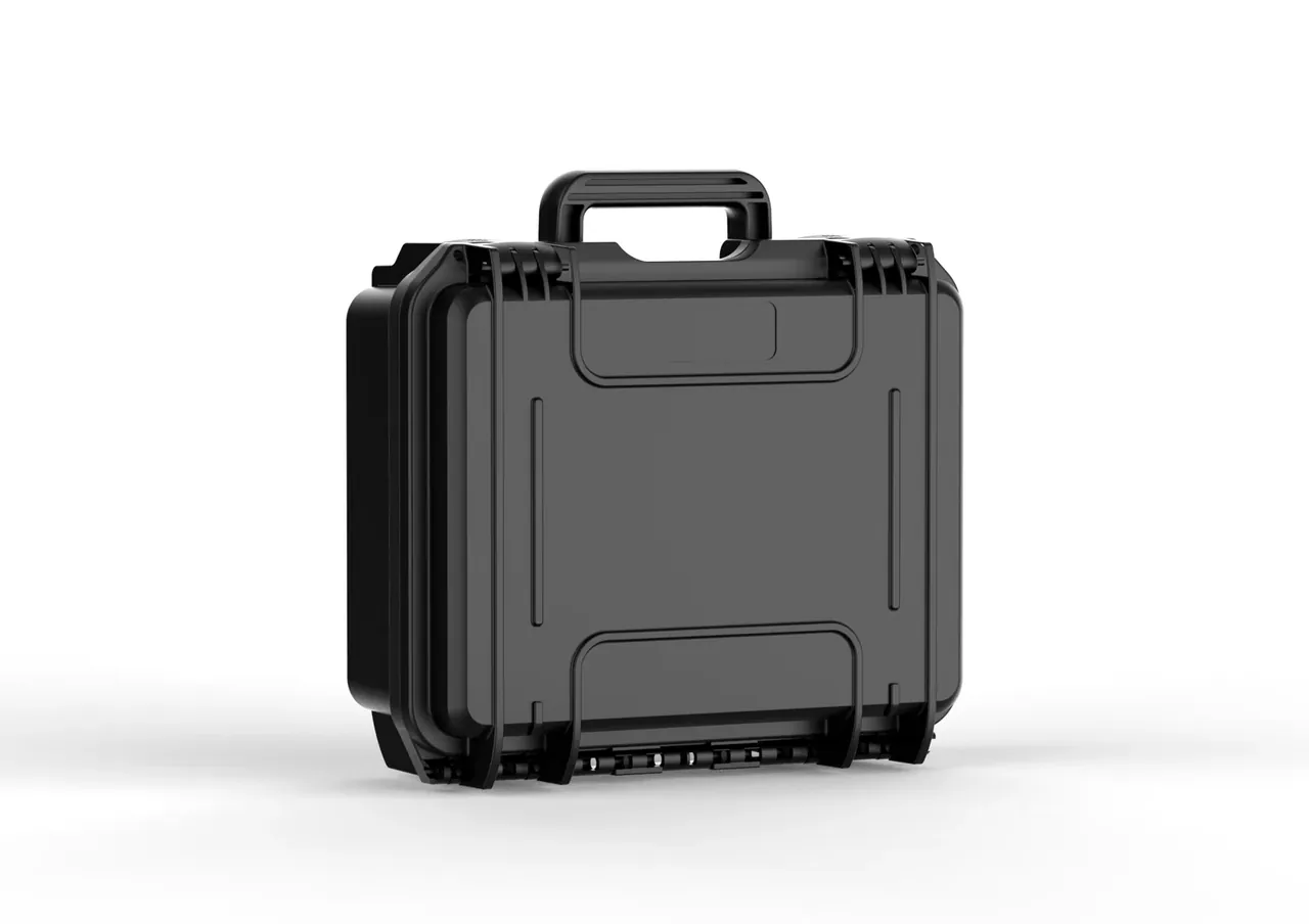 The same body from the rear three-quarter, the hinge running along the bottom edge, body depth and top handle visible