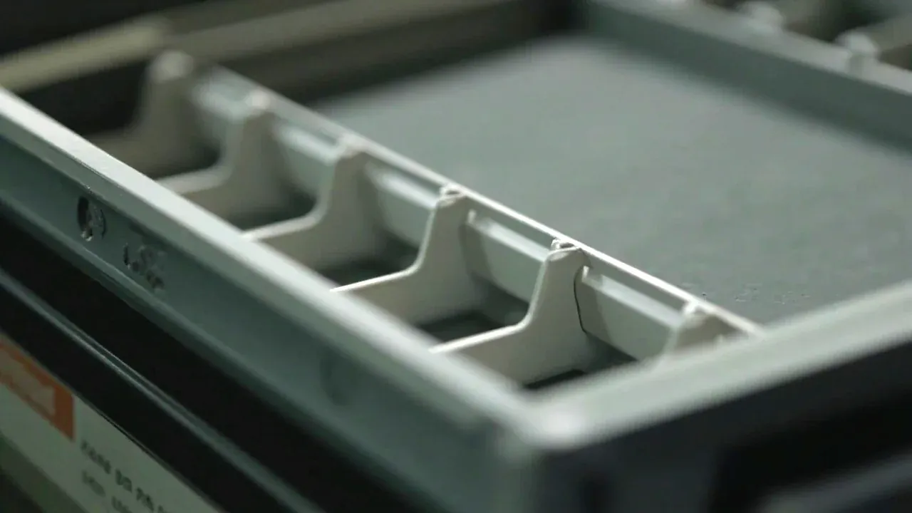 Close-up of the tray divider layout inside the first aid case