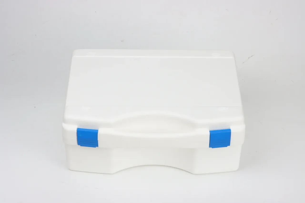 Flame retardant case in white, closed and facing forward, two blue catches at the front edge, a wide curved recess between them