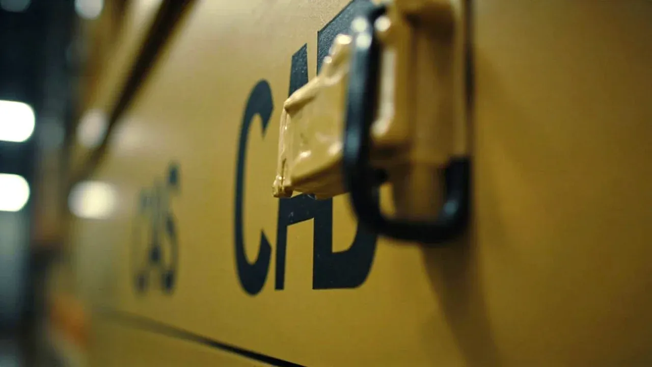 Close-up of the three-point locking bar on the cabinet