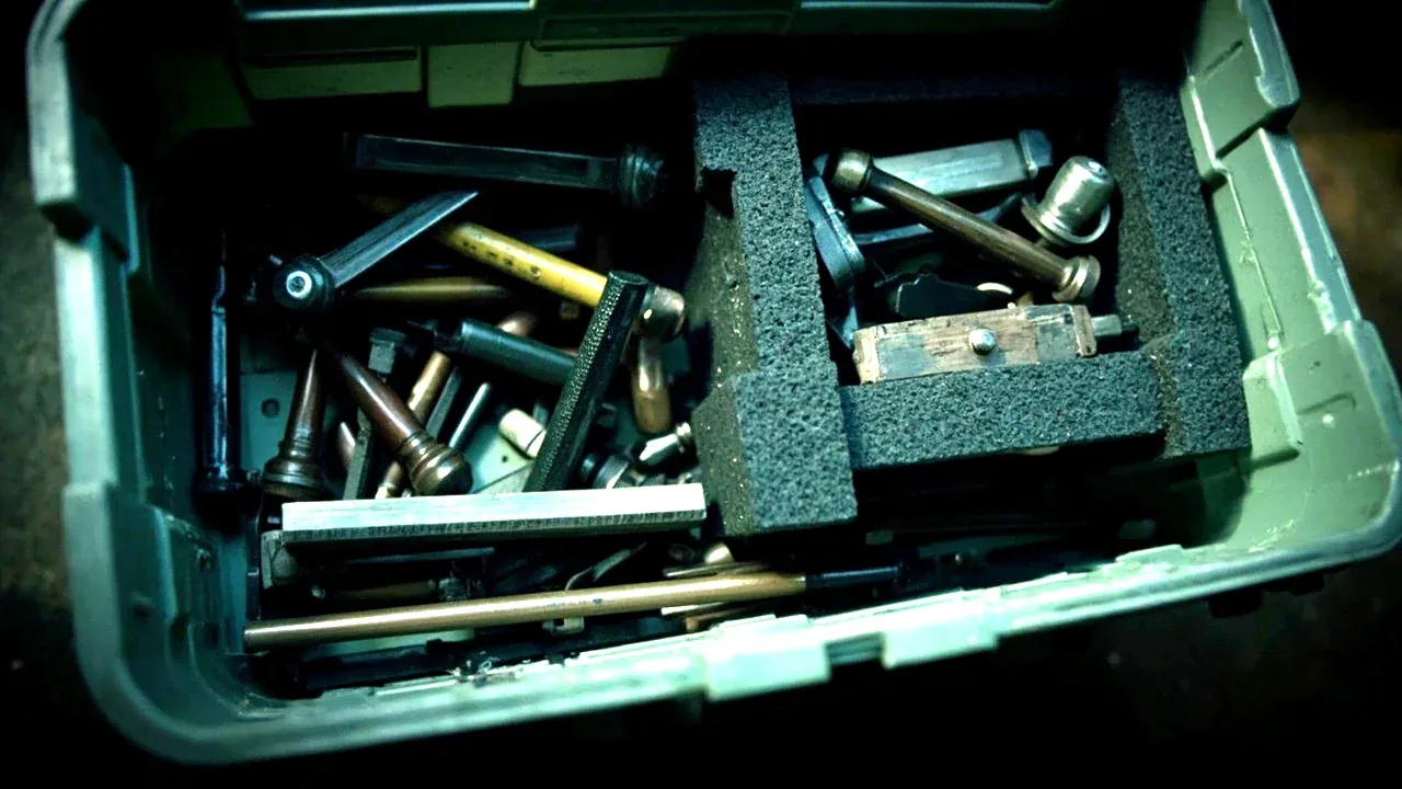 Close-up of unused space above tools packed loose in a bin versus a snug foam layout
