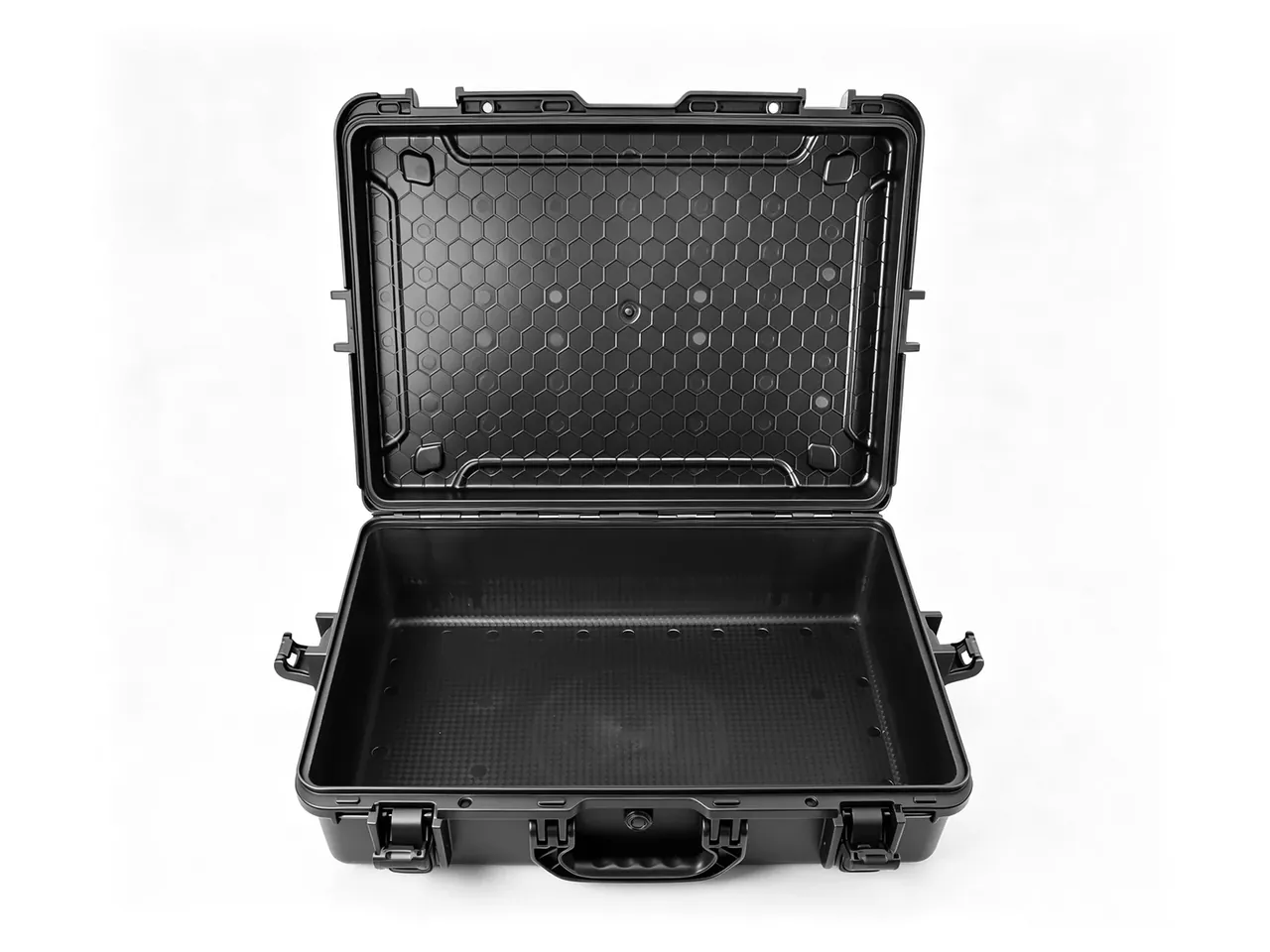 Case open, lid standing, honeycomb ribs across the lid interior, empty base and a round pressure valve on the front wall