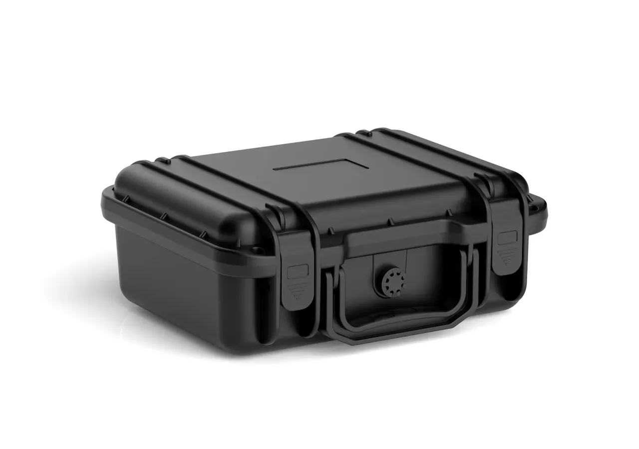 Case lying flat, lid closed, label slot on the lid, two latches on the front edge and the handle folded against the body