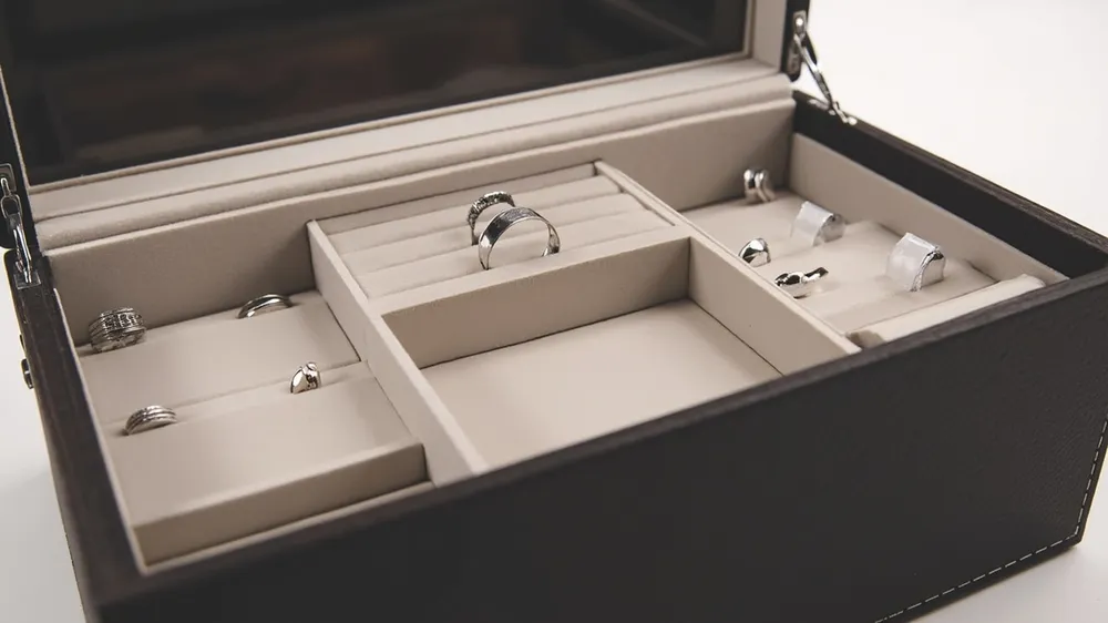 Custom molded foam compartments for rings, watches and necklaces in a case