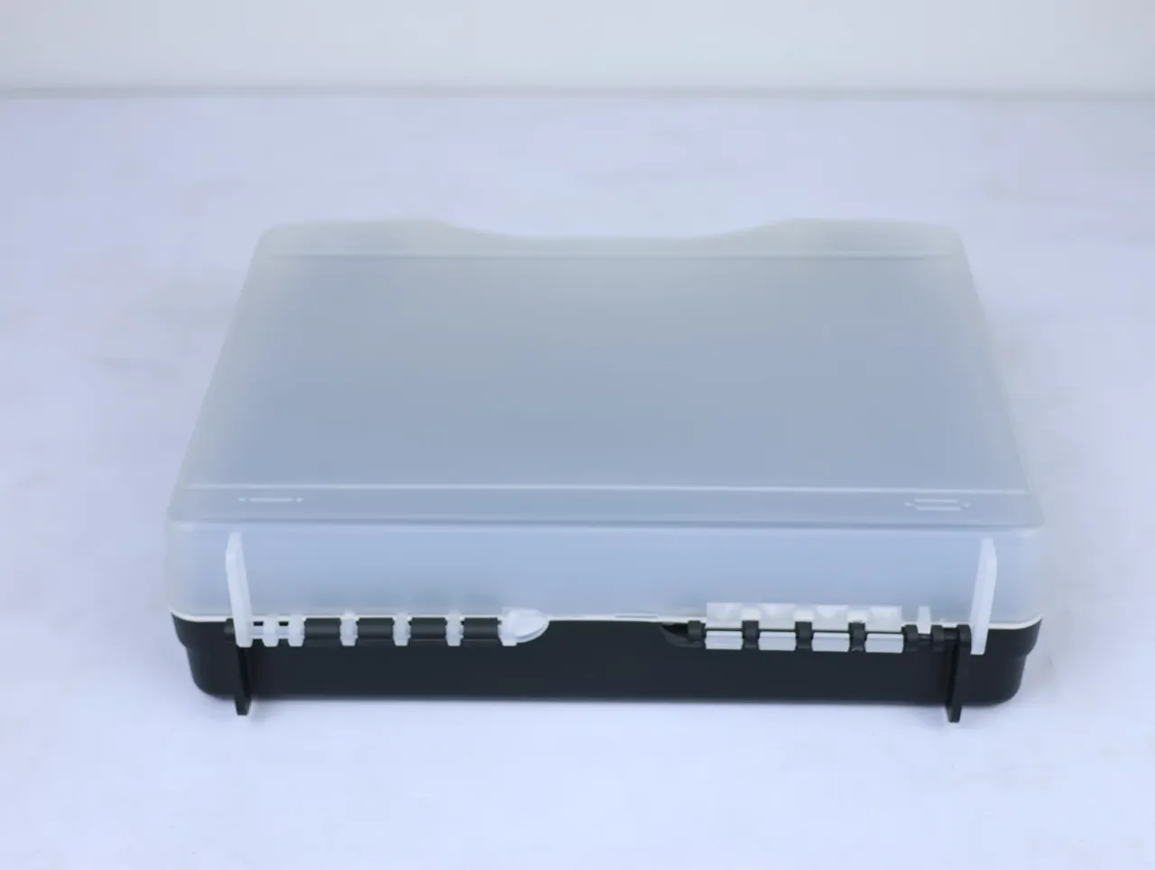 Knife Case: front view, white hinge knuckles in a row along the lower lid edge above the black base, a tab at each end