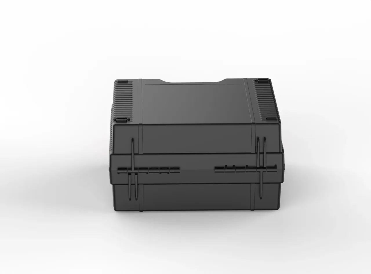 A black case closed from the front, vertical ribs both sides and the lid-to-base seam running level along its length