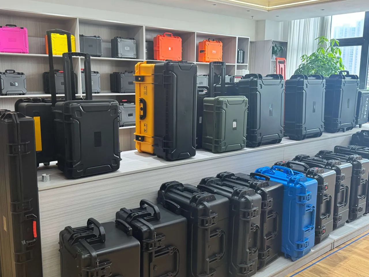 Stacked metal powder cases in a zoned storage area connected to grounding bus and breather valves