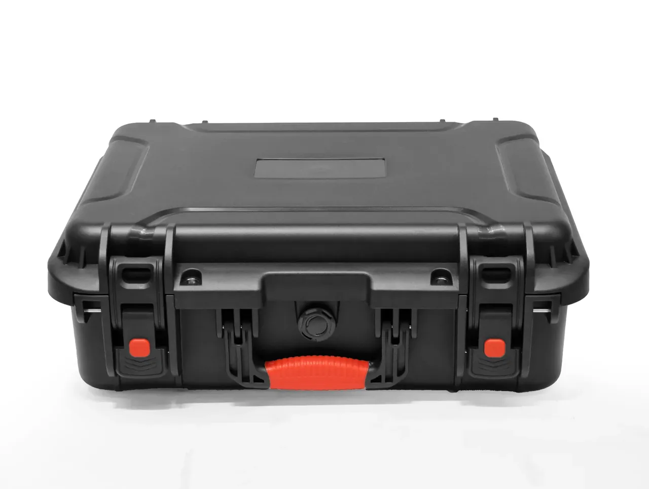 The black case from the front, red handle folded flat, two latches with red buttons, a round valve at the centre