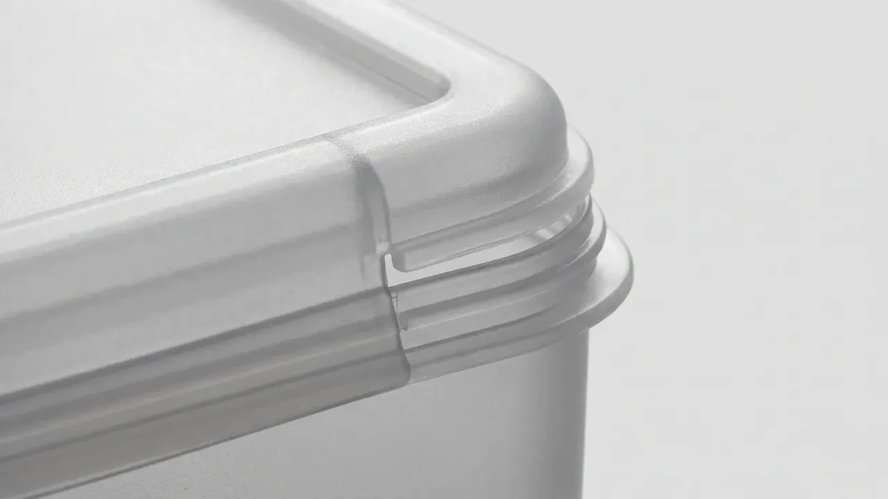 White lid rim interlocks in two steps, leaving a gasket channel