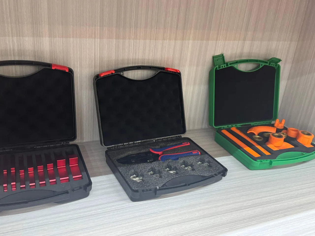 An operator loading printed circuit boards into a transport case with static-dissipative dividers and placing a humidity indicator card