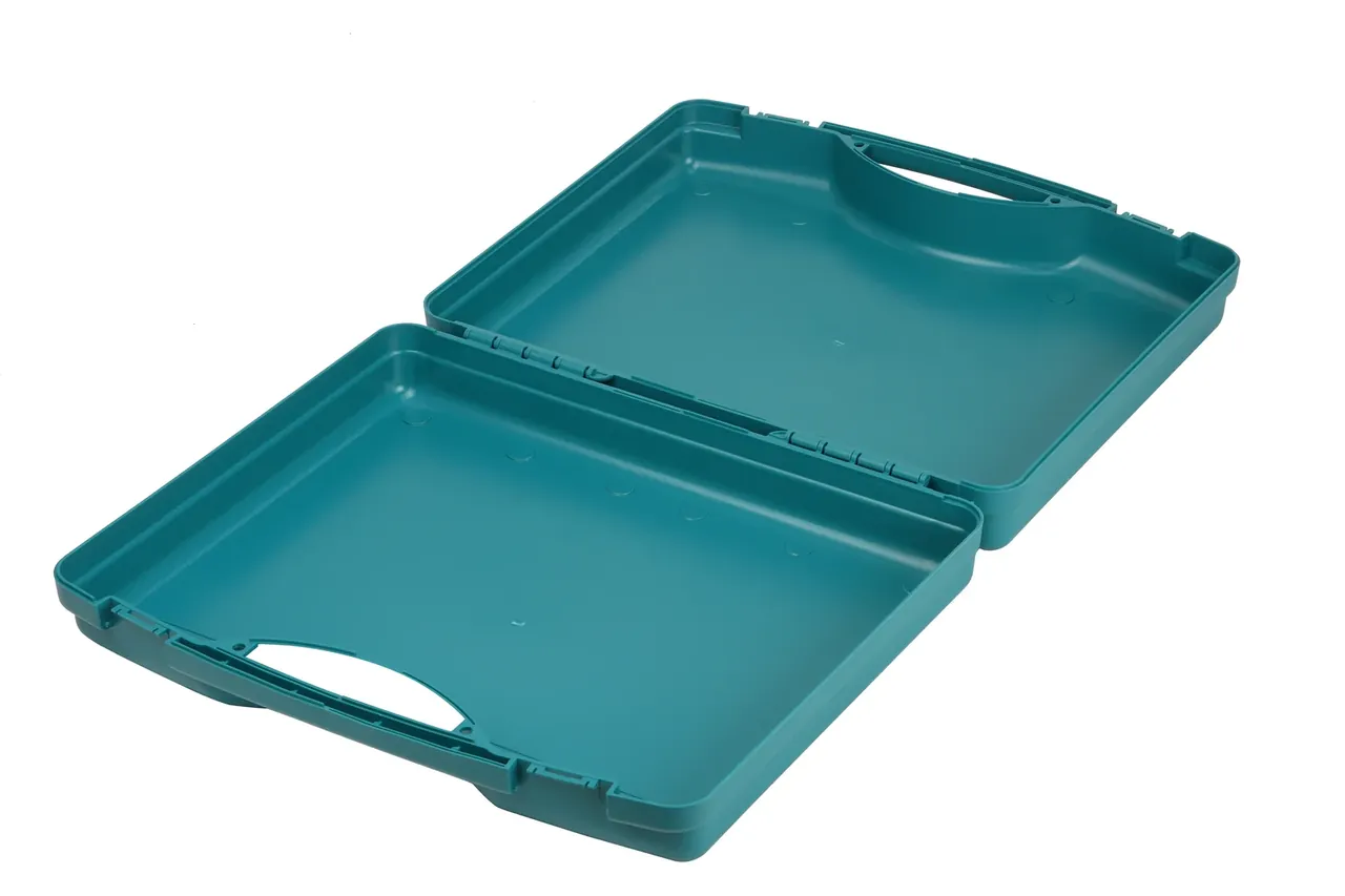 Teal case open from above, both halves hollow without liner, one-piece hinge, circular ejector marks in the base