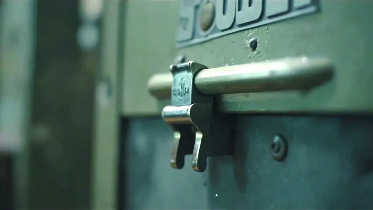 Close-up of the case latch beside a simple clip latch