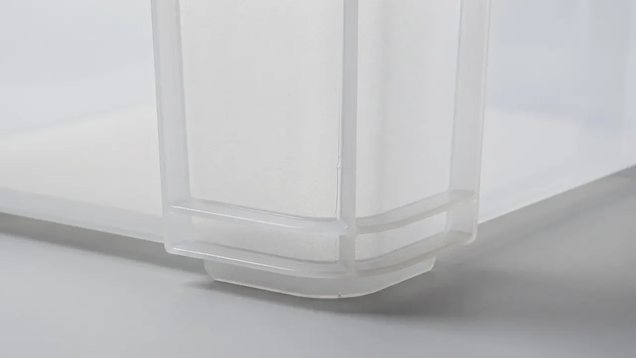 Tactical Hard Case: close view of a frosted translucent case corner, moulded ribs forming a foot pad under the rounded edge