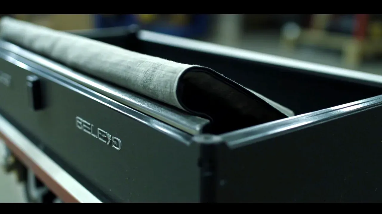 Soft cover peeled back, rim and coated lining visible