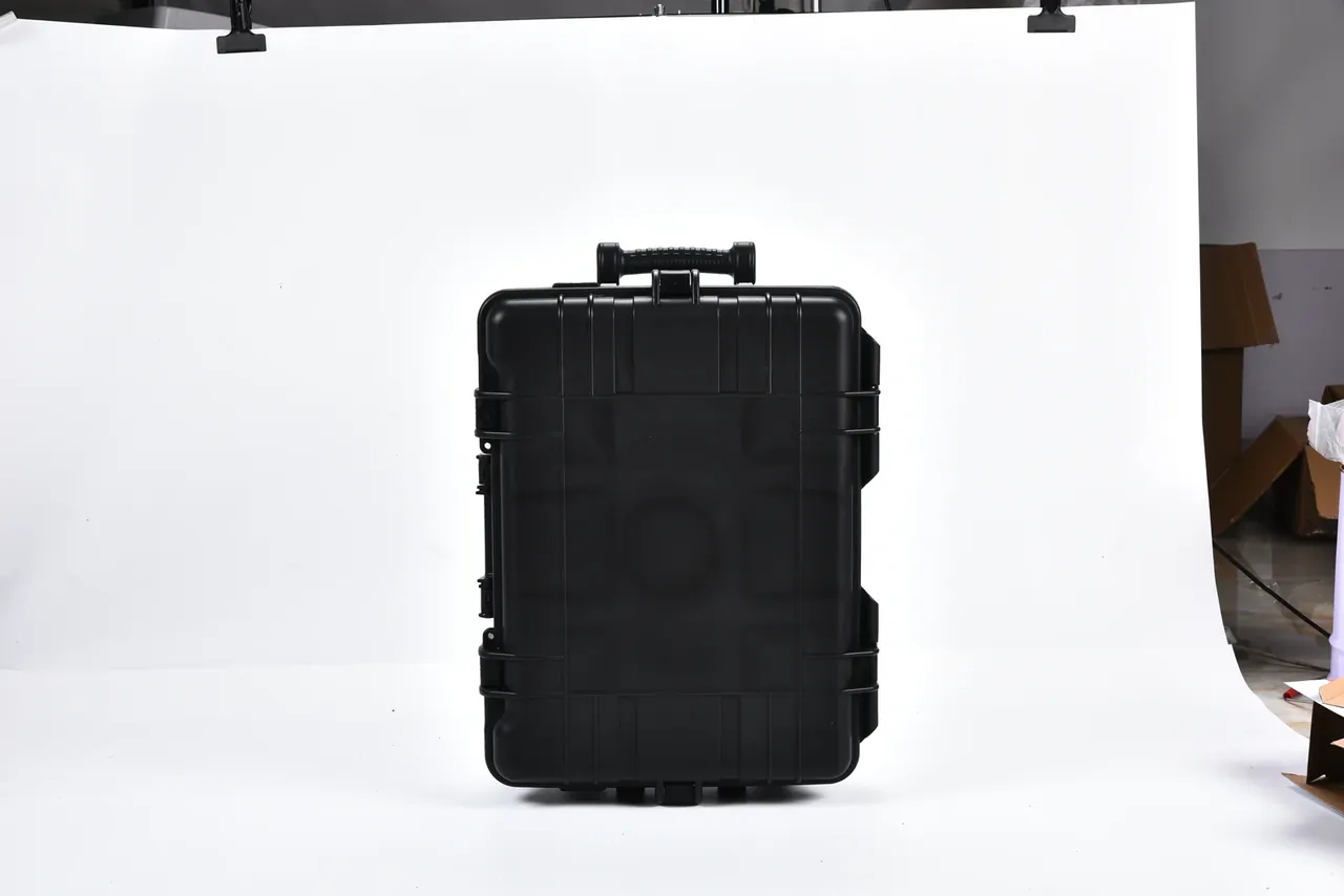 Black case upright against a white background with the handle and telescoping handle both retracted