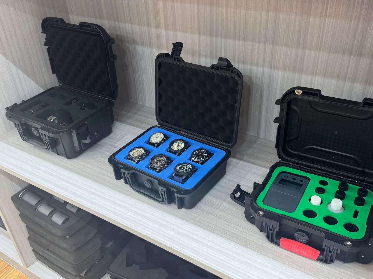 A wafer carrier being placed into a transport case with cushioning inserts and corner location checks