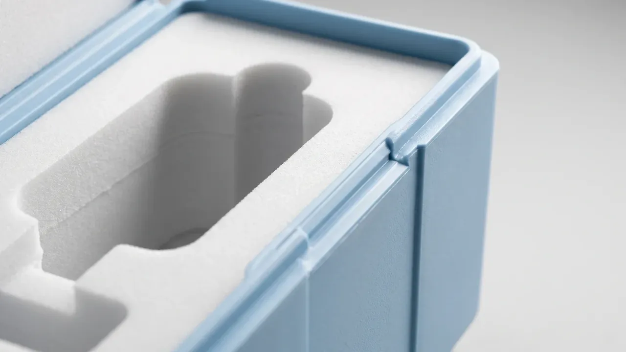 Weapon Storage Cabinet: close view of a pale blue case rim, white foam insert cut with a long finger lift cavity, tongue and groove seal along the edge